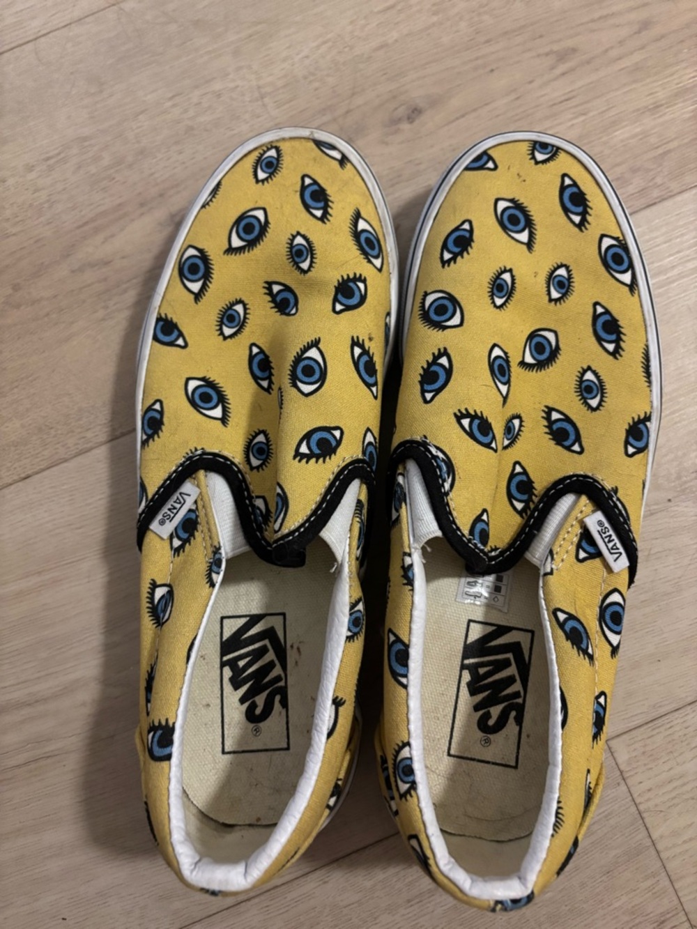 Vans  Yellow Slip-On Sneakers with Blue Eye Print